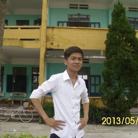 Young Vietnamese entrepreneur outside his school building